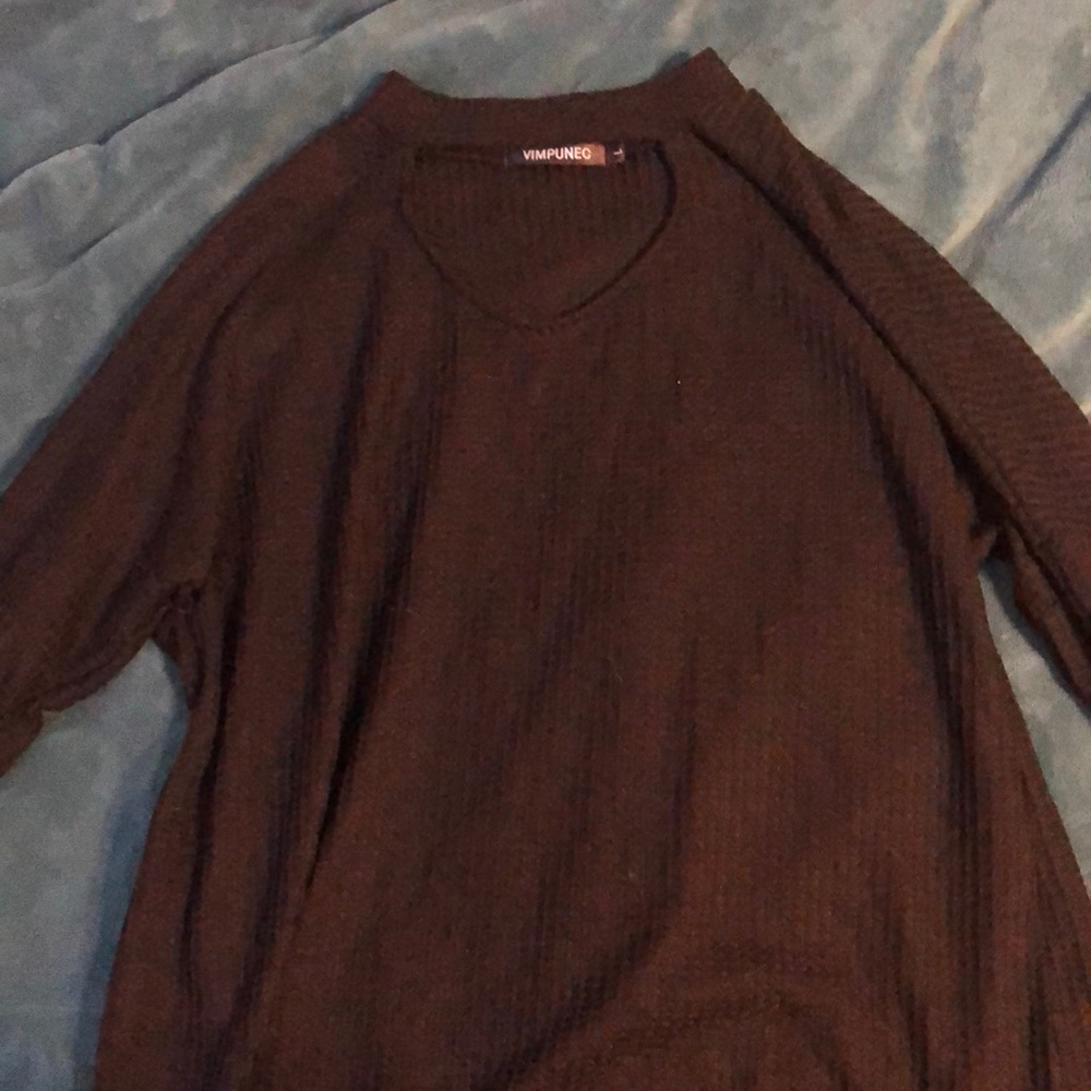 black sweater with a slit in the neck